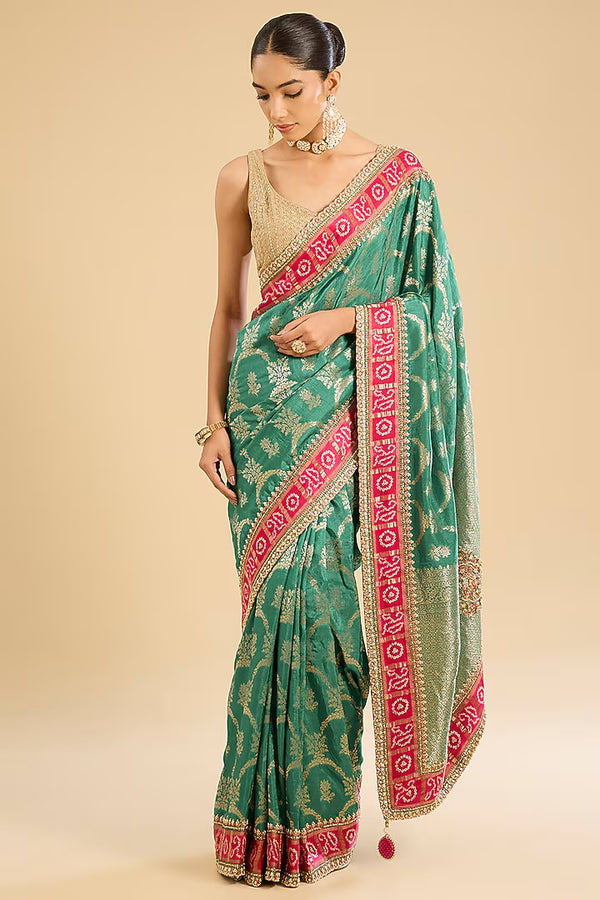 The Emerald Veil: Bottle Green Georgette Saree with Zari Work