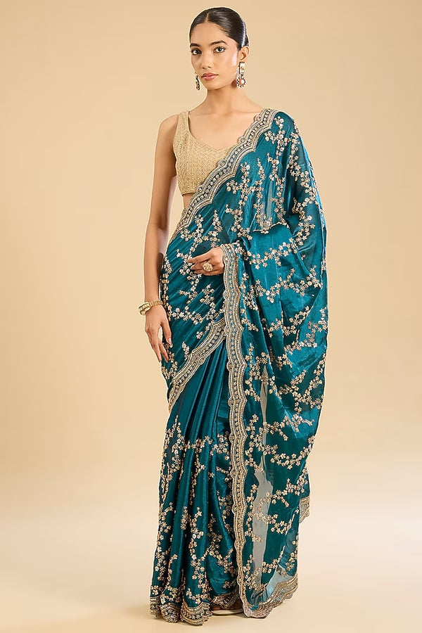 The Crystal Peacock: Peacock Blue Glass Tissue Saree with Cutdana Work