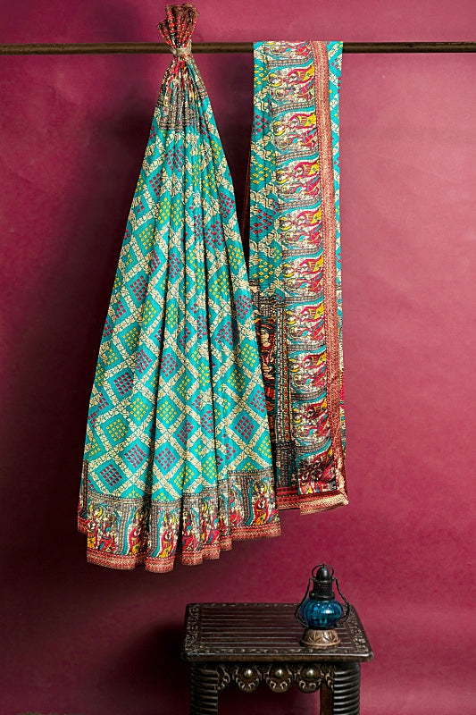 The Flute Song Saree: Peacock Georgette Bandej with Colourful Border Radha Krishna Motifs